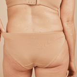 Back view of the Springrose adaptive underwear in beige. It's full coverage.