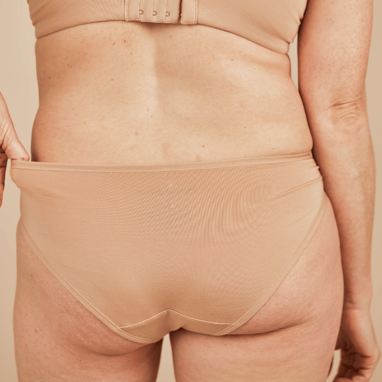 Back view of the Springrose adaptive underwear in beige. It's full coverage.