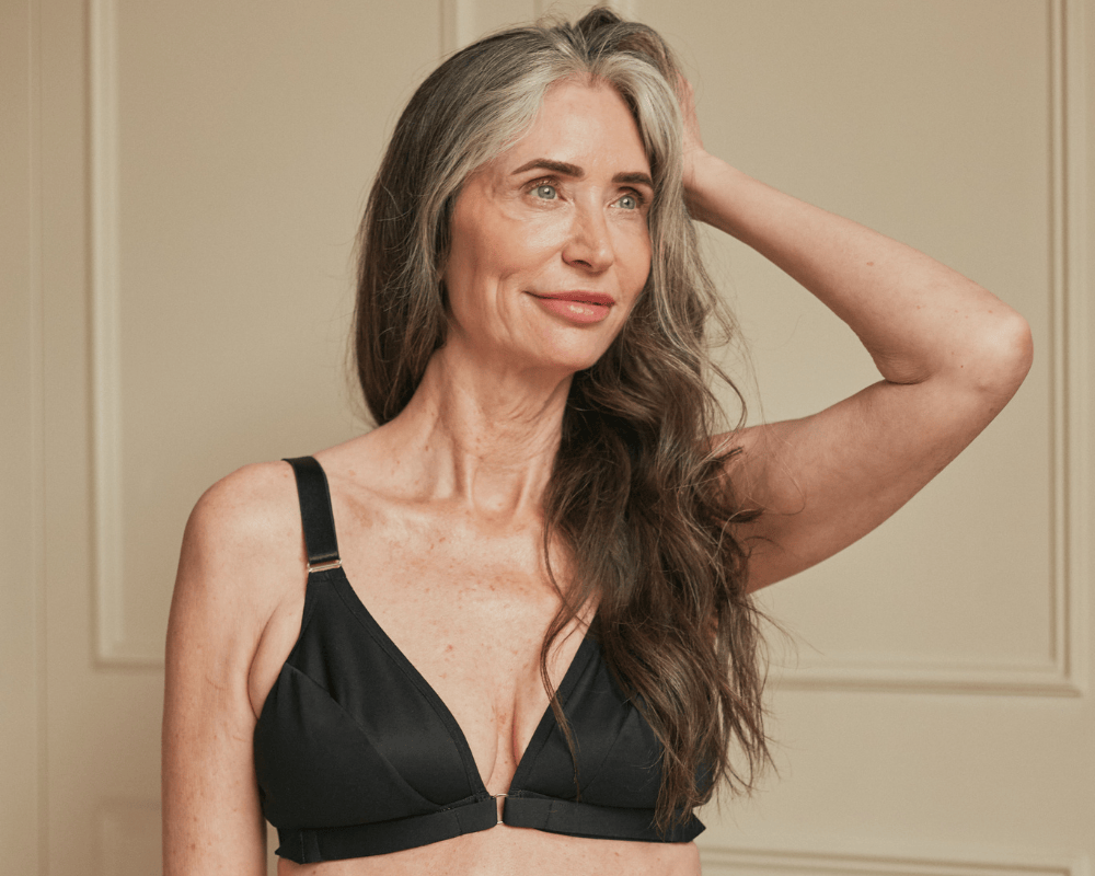Beautiful older model showcasing the Springrose easy-on front close bra in black