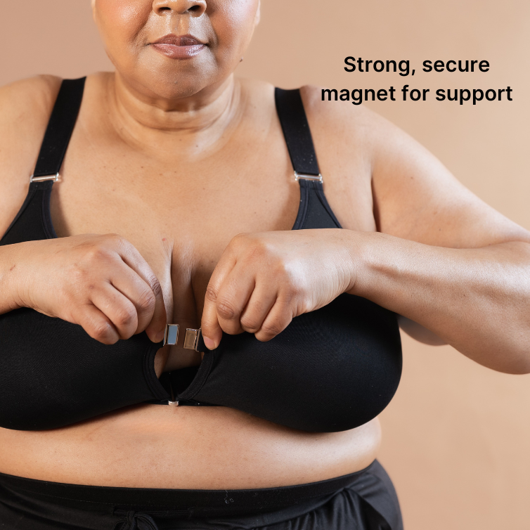 Beautiful black model showing the magnet clip of the adaptive velcro bra in black