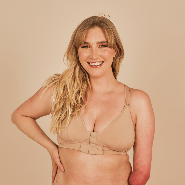 Beautiful model with a limb difference showcasing the front view of the Springrose adaptive magnetic bra