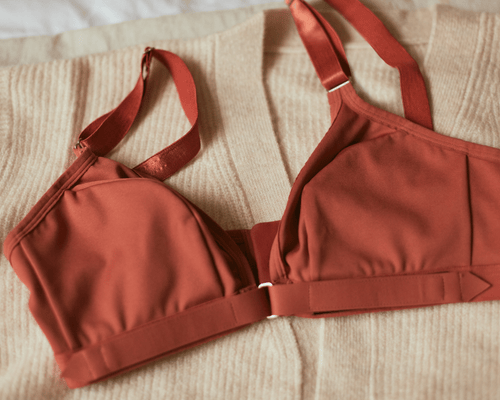Flatlay of the Springrose adaptive bra in terracotta