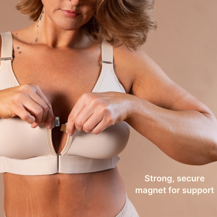 Beautiful mature model showing the magnet closure of the adaptive bra in almond
