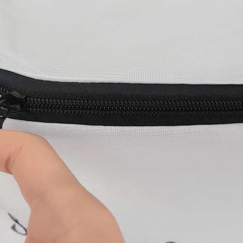 GIF of an easy open wash bag being opened and closed with the zipper's ring