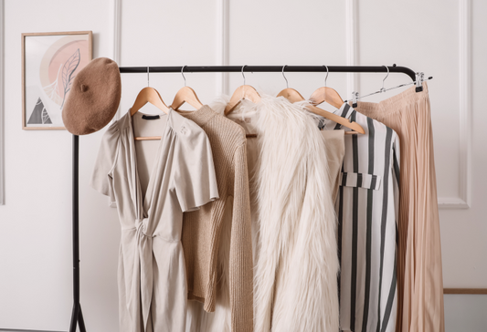 Clothing rack filled with neutral colored clothing that can work as adaptive clothing