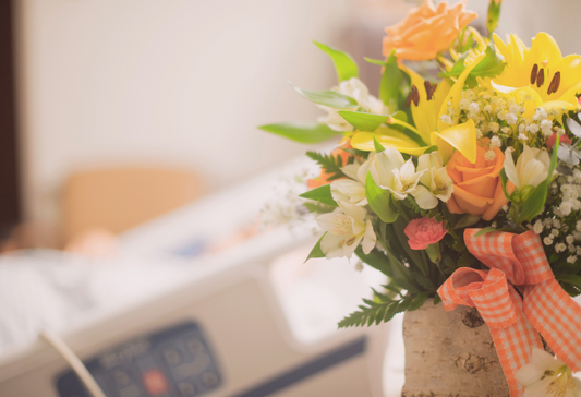 Preparation for shoulder surgery: a bouquet of flowers next to a hospital bed