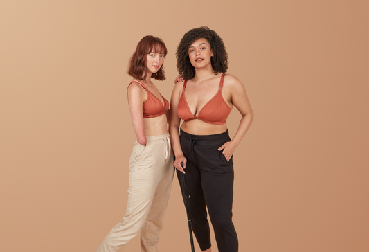 Two beautiful disabled models smizing at the camera while wearing the Springrose adaptive bra