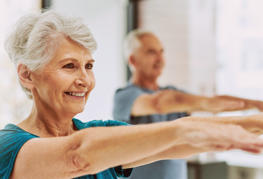 Osteoarthritis tips - two attractive older adults happily exercising