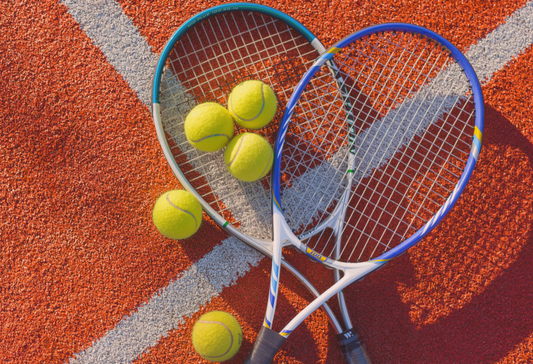 Recovery from tennis elbow surgery: Tennis racquets on a court with tennis balls