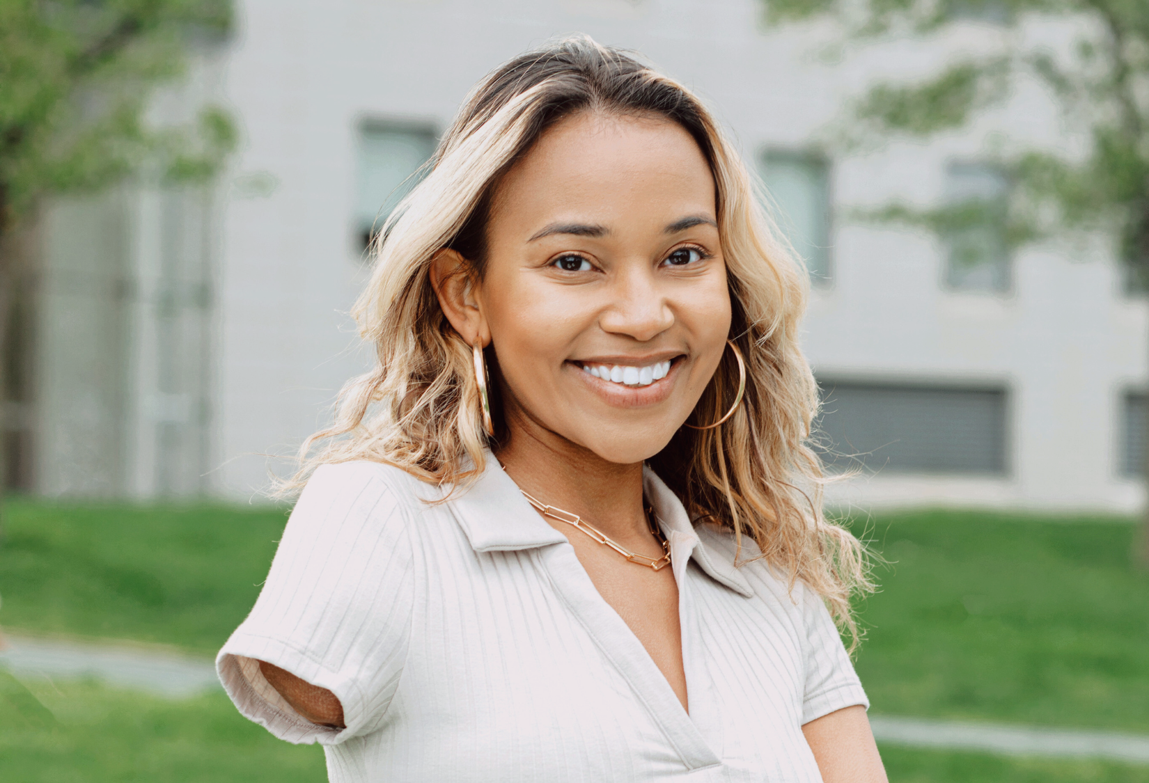 Clothing for Women with Amputations: Amputee woman smiling wearing a white top