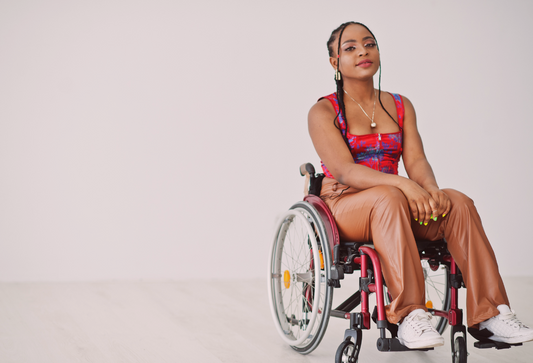 Pelvic health therapy and disability: young, stylish black woman in a wheelchair