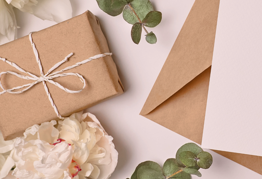Gifts parkinson's patients showcasing a brown paper wrapped package surrounded by flowers