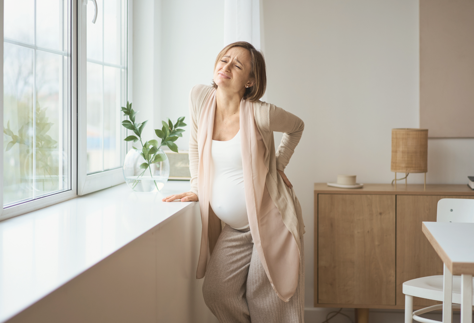 Pregnant woman with nerve pain in her lower back
