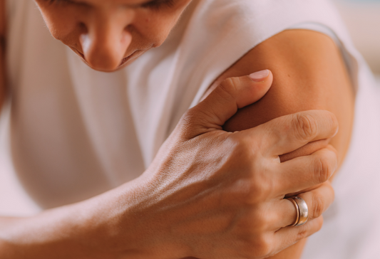 Tips For Rotator Cuff Surgery Recovery article: woman grabbing her shoulder