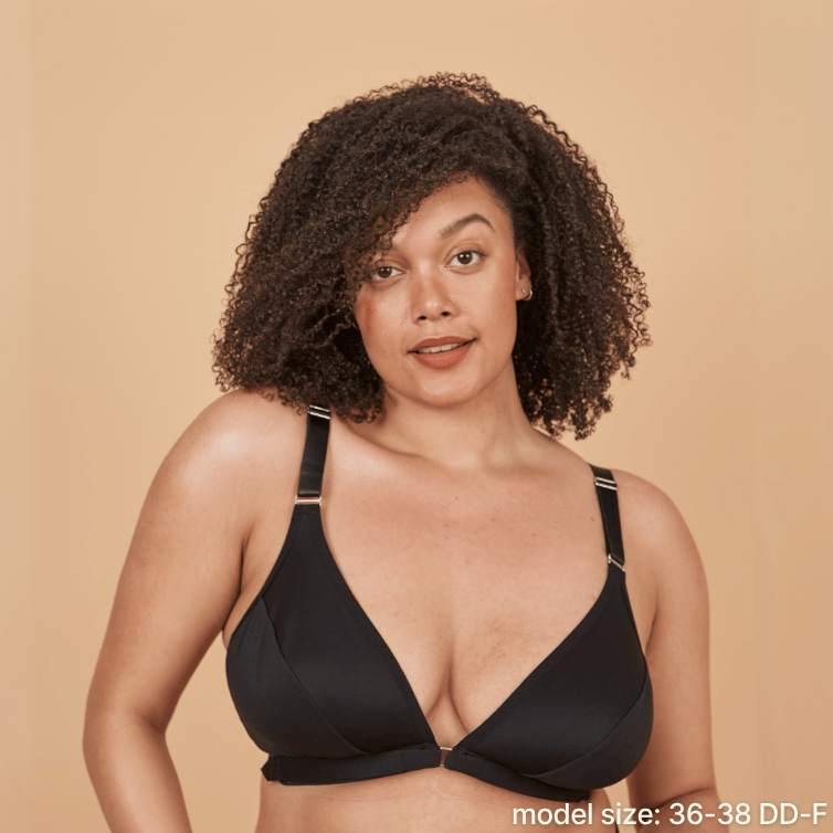 Model is wearing the best front closing bra for seniors in black - an adaptive bra with a velcro front closure