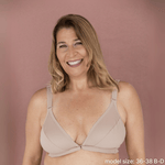 Model is wearing the best front closing bra for seniors in beige - an adaptive bra with a velcro front closure