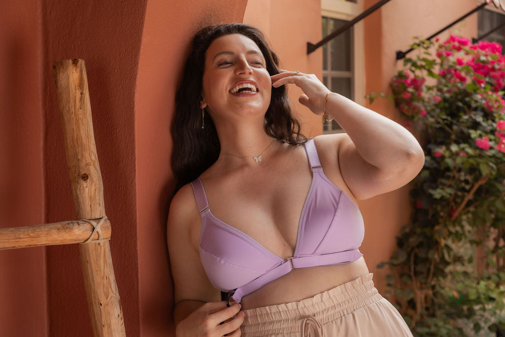 Beautiful young woman wearing the Springrose velcro front closure adaptive bra in lilac while laughing
