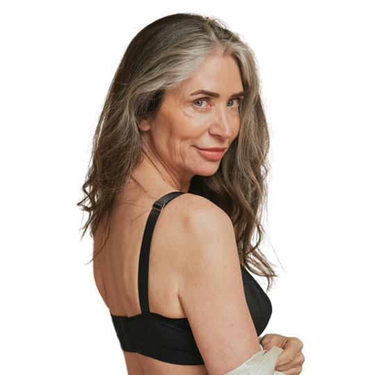 Beautiful older woman smizing into camera while wearing the Springrose front closure bra in black