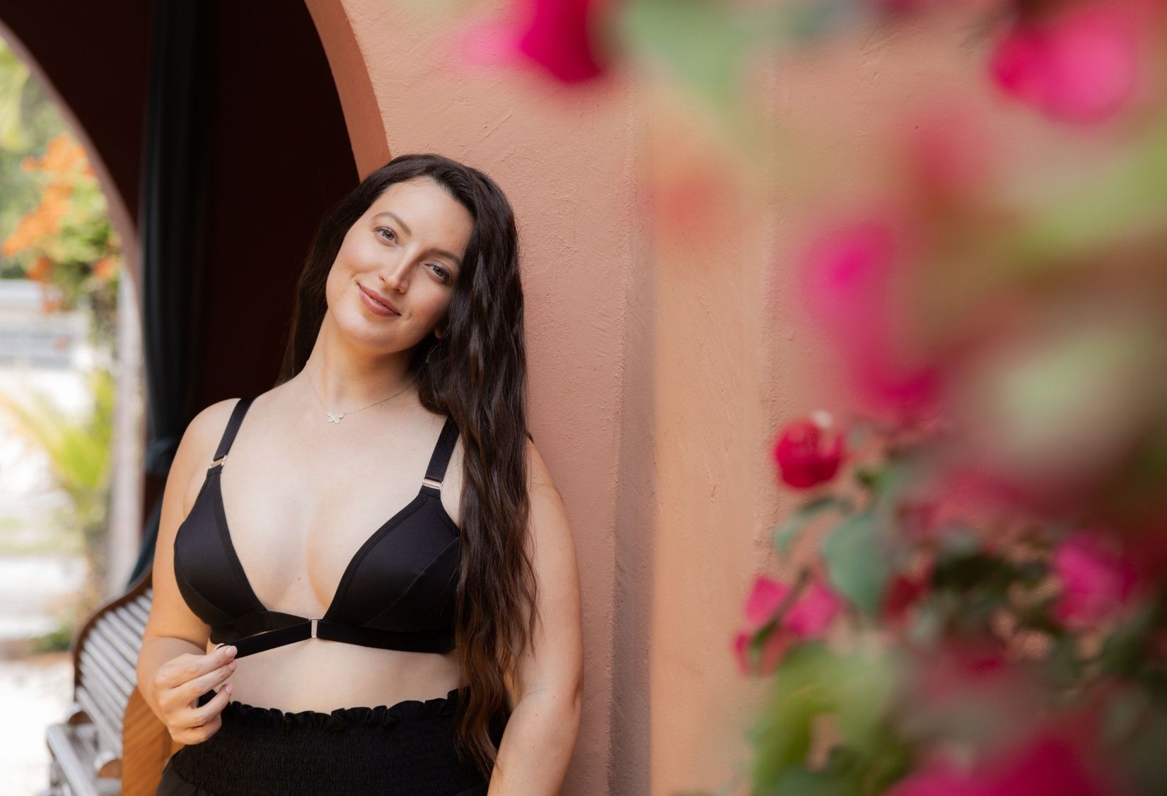 Bra for limited range of motion: Woman wearing and adjusting the Easy-On Mobility Bra for limited range of motion.