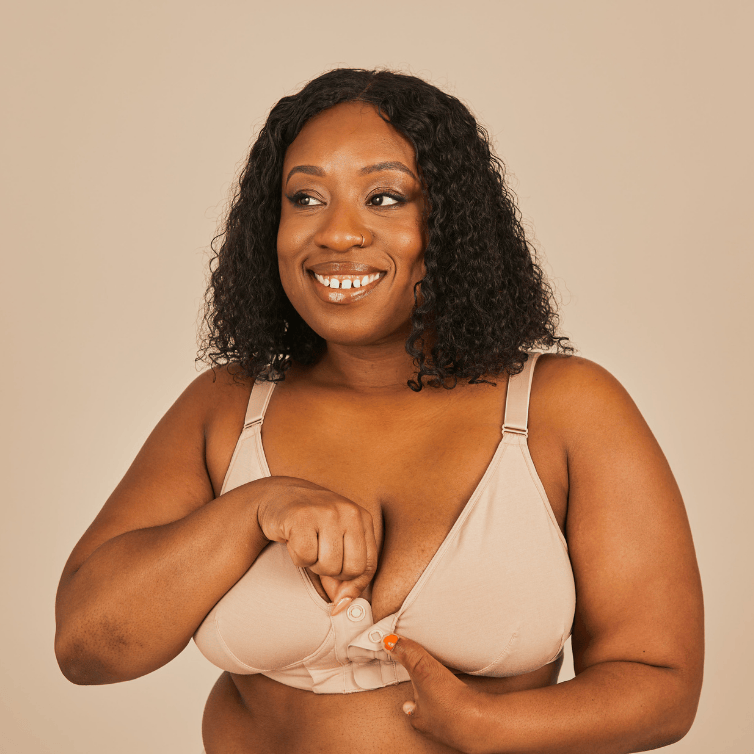 Beautiful model with a limb difference showcasing the magnet front closure on the magnetic bra from Springrose in beige.