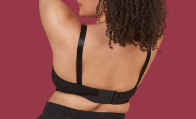 View of a woman's back showcasing the back of the adaptive velcro bra