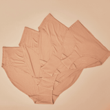 Flat lay of the modal high waisted underwear in beige. Four sizes are visible.