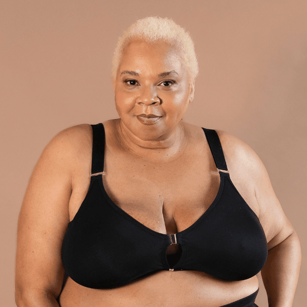 Beautiful black model showing the supportive adaptive velcro bra in black