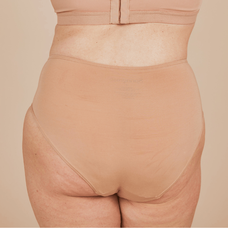 Back view of the sensory-friendly modal high waisted underwear in beige.