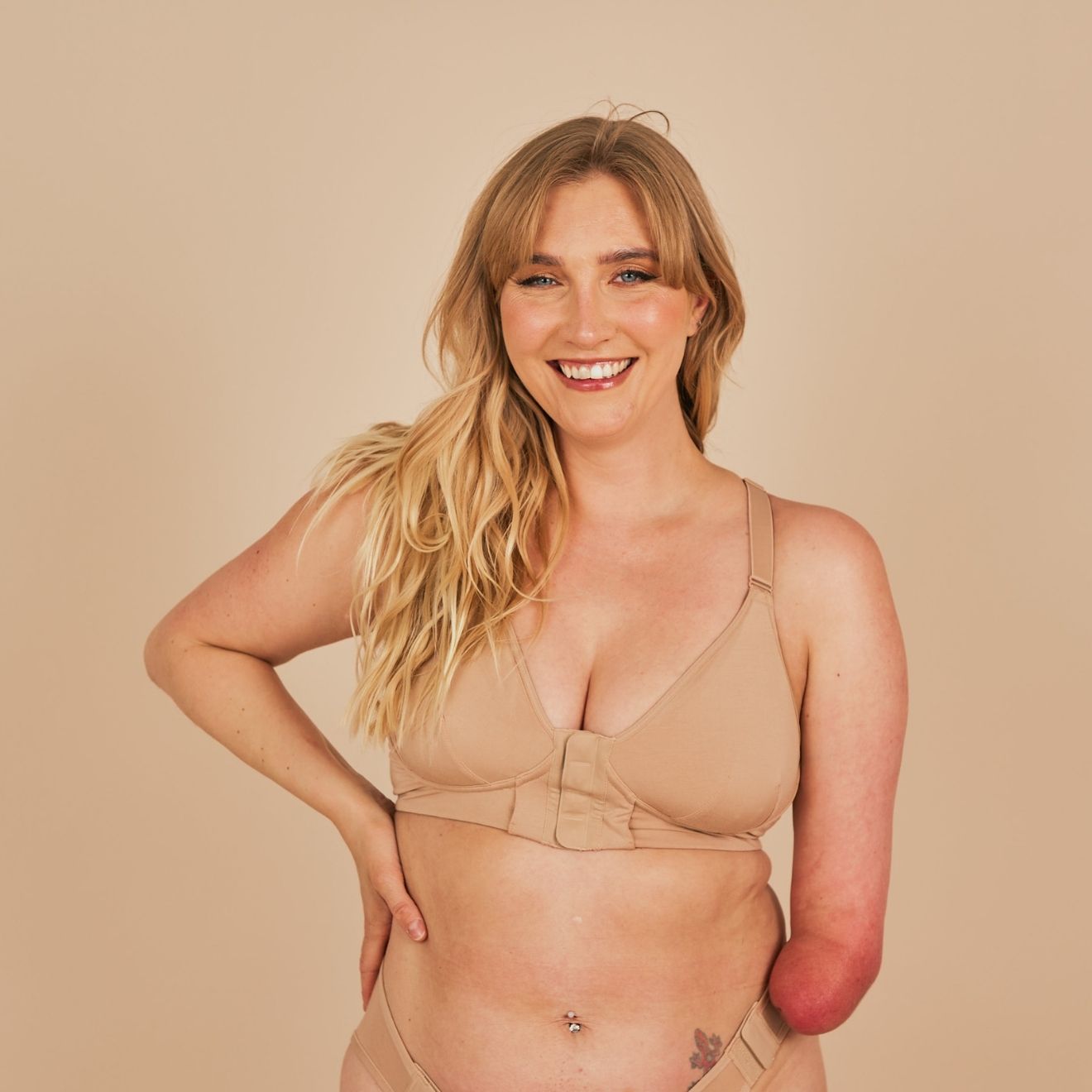 Beautiful model smiling widely at the camera while wearing the Springrose bras for elderly with dementia in beige
