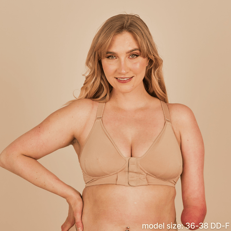 Beautiful model with a limb difference with a sultry smile, showcasing the front view of the Springrose adaptive magnetic bra