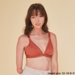 Model with one hand is wearing the best one handed bra - an adaptive bra with a velcro front closure