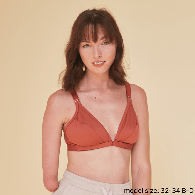 Model with one hand is wearing the best one handed bra - an adaptive bra with a velcro front closure