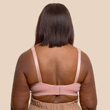 Back shot of a beautiful black model wearing the Springrose Velcro bra in pink