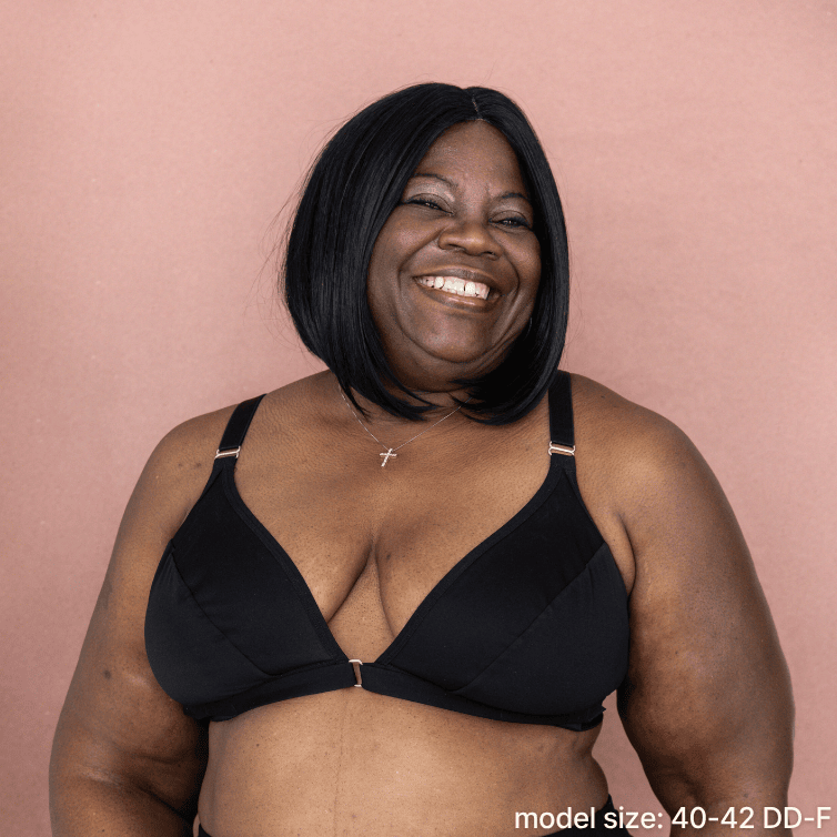 Model is wearing the best front closing bra for seniors in black - an adaptive bra with a velcro front closure