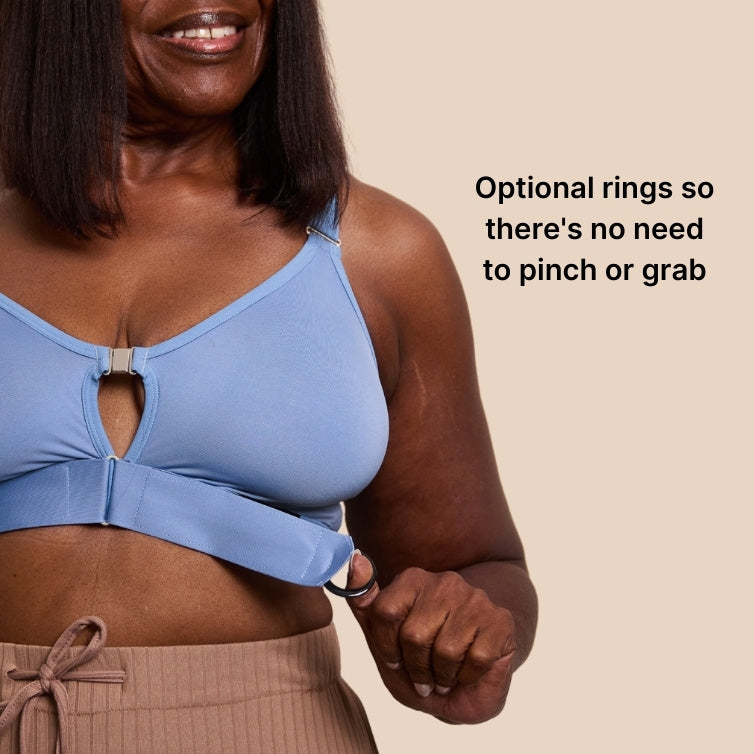 Close up of the optional gripping rings on the Springrose velcro bra in Neptune Blue. Text reads: optional rings so there's no need to pinch or grab.