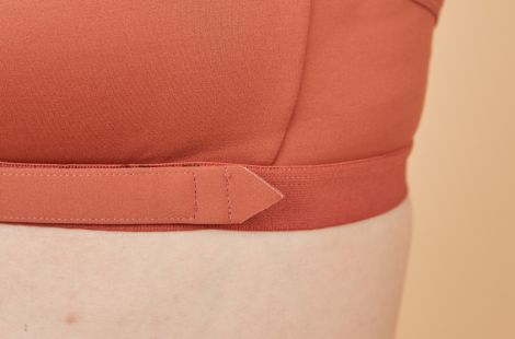Close of the adaptive bra's front closure's pointed tip, making it a bra for stroke victims / patients since it is easier to insert in the front close
