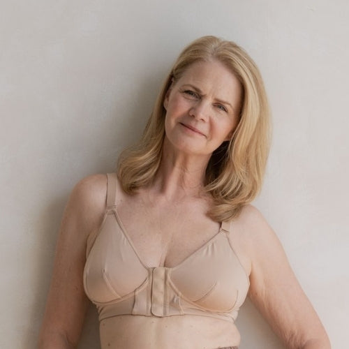 Beautiful mature model wearing the Springrose magnet bra for EDS while smiling lightly at the camera